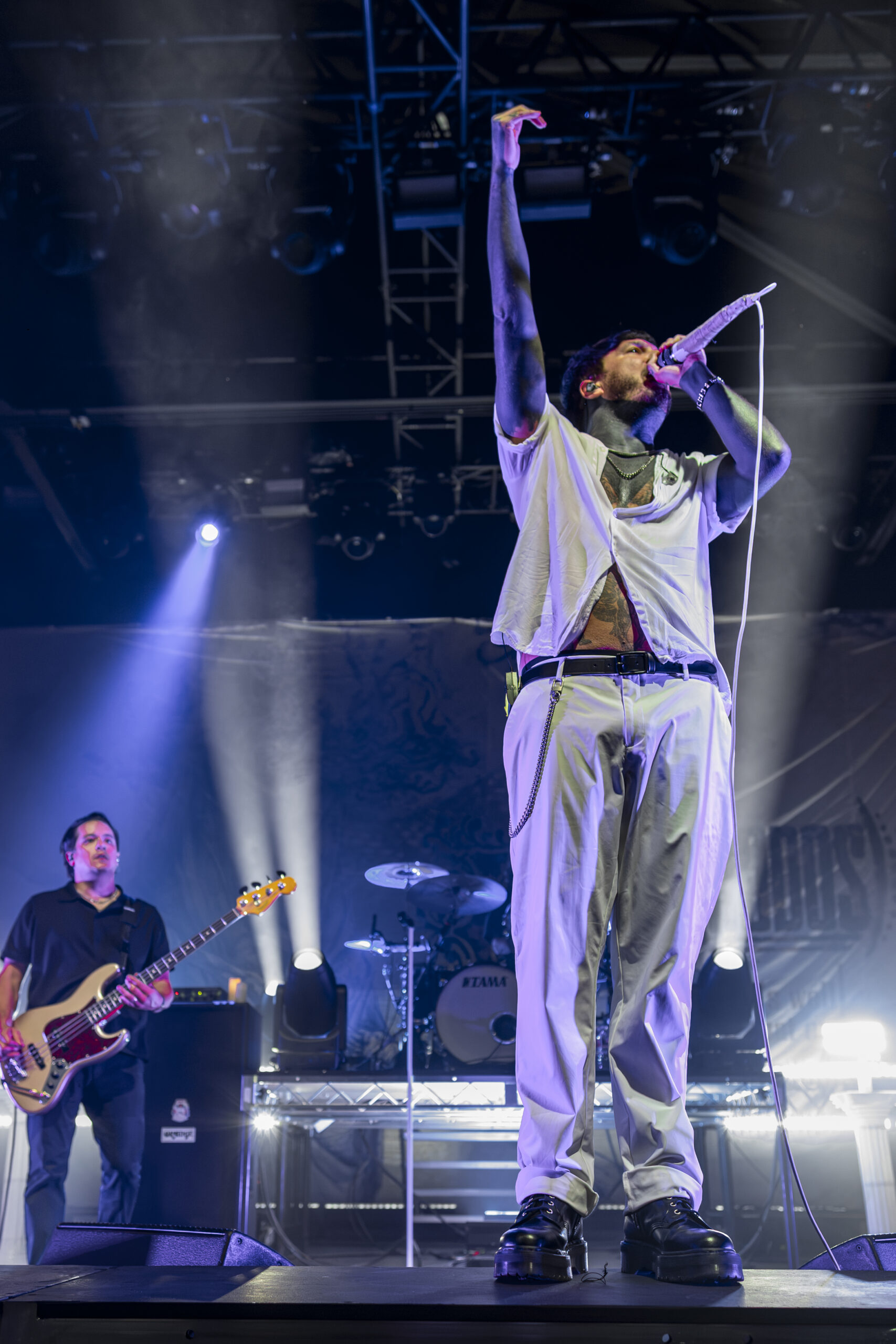 Chiodos vocalist raises an arm while performing at the Fillmore.