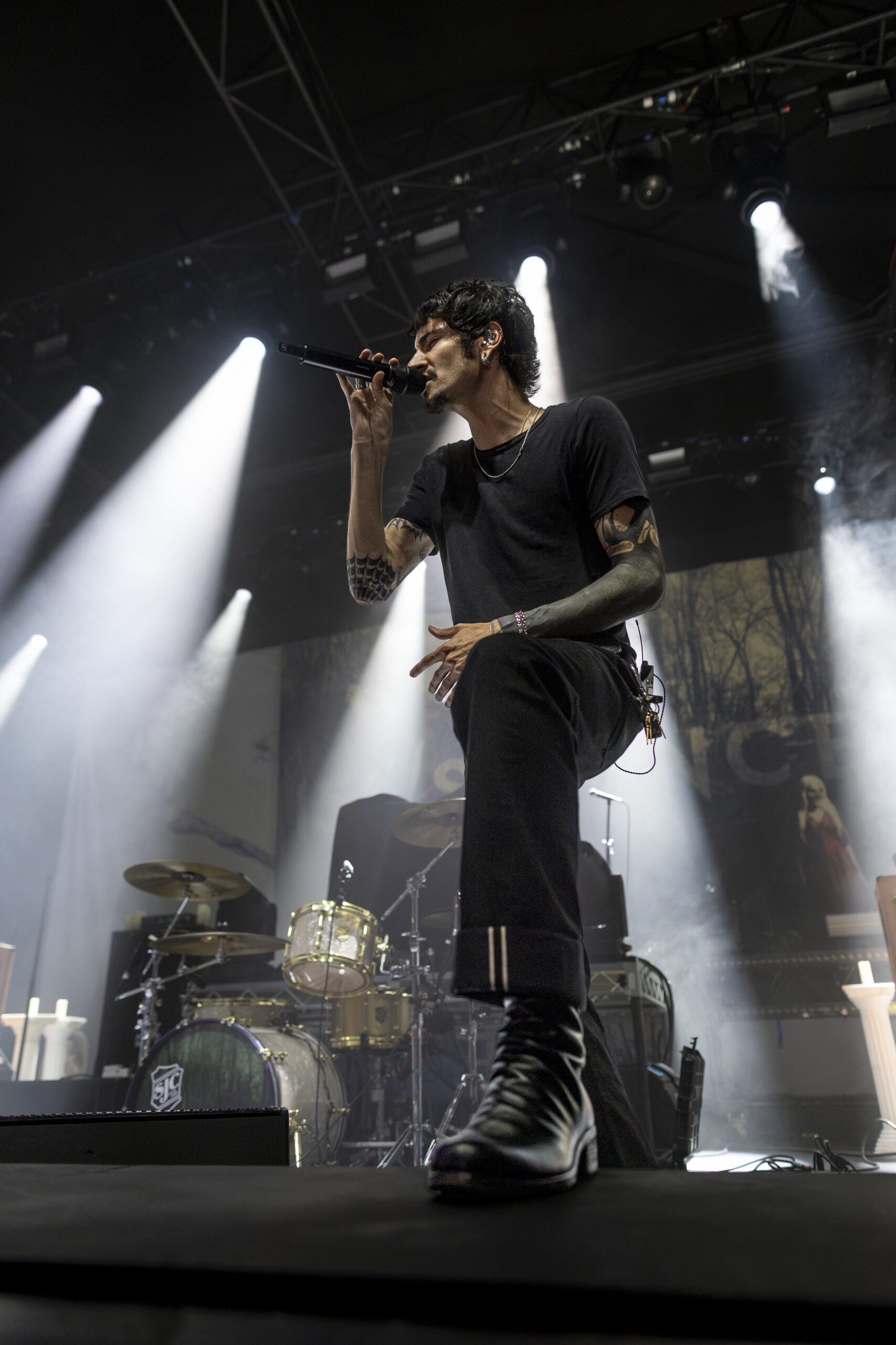 Chiodos vocalist performs beneath white stage beams at the Fillmore.