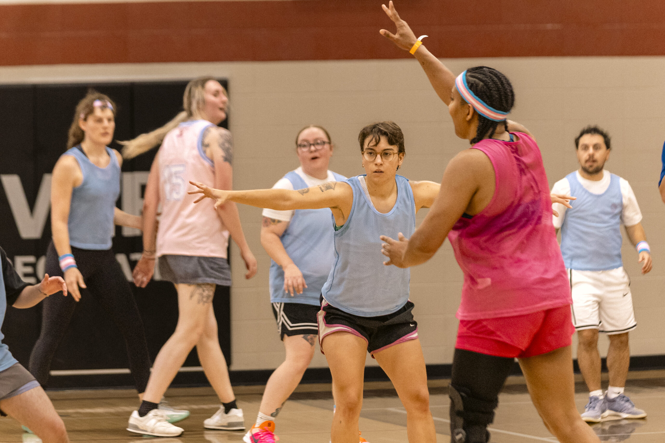 Players face off during a trans community basketball game.